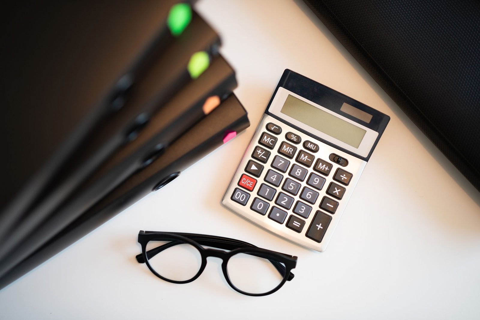 A calculator and documents used to compare workers compensation and VA disability benefits