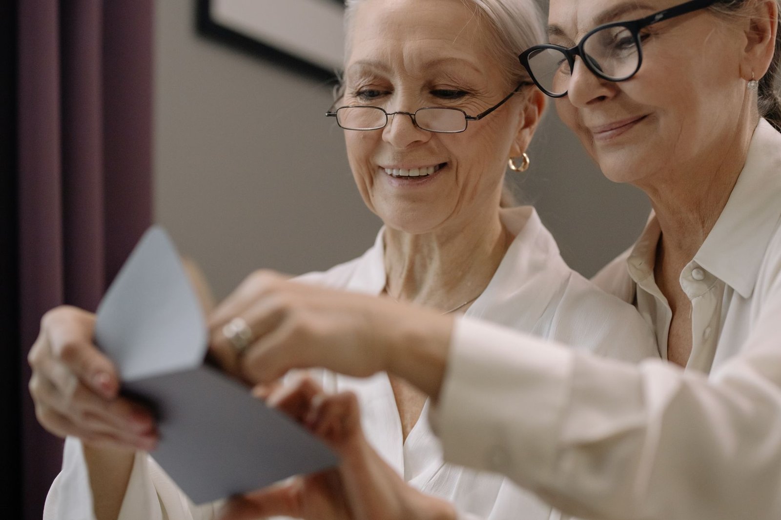 Veteran and spouse reading a decision letter while considering clear and unmistakable error VA claims