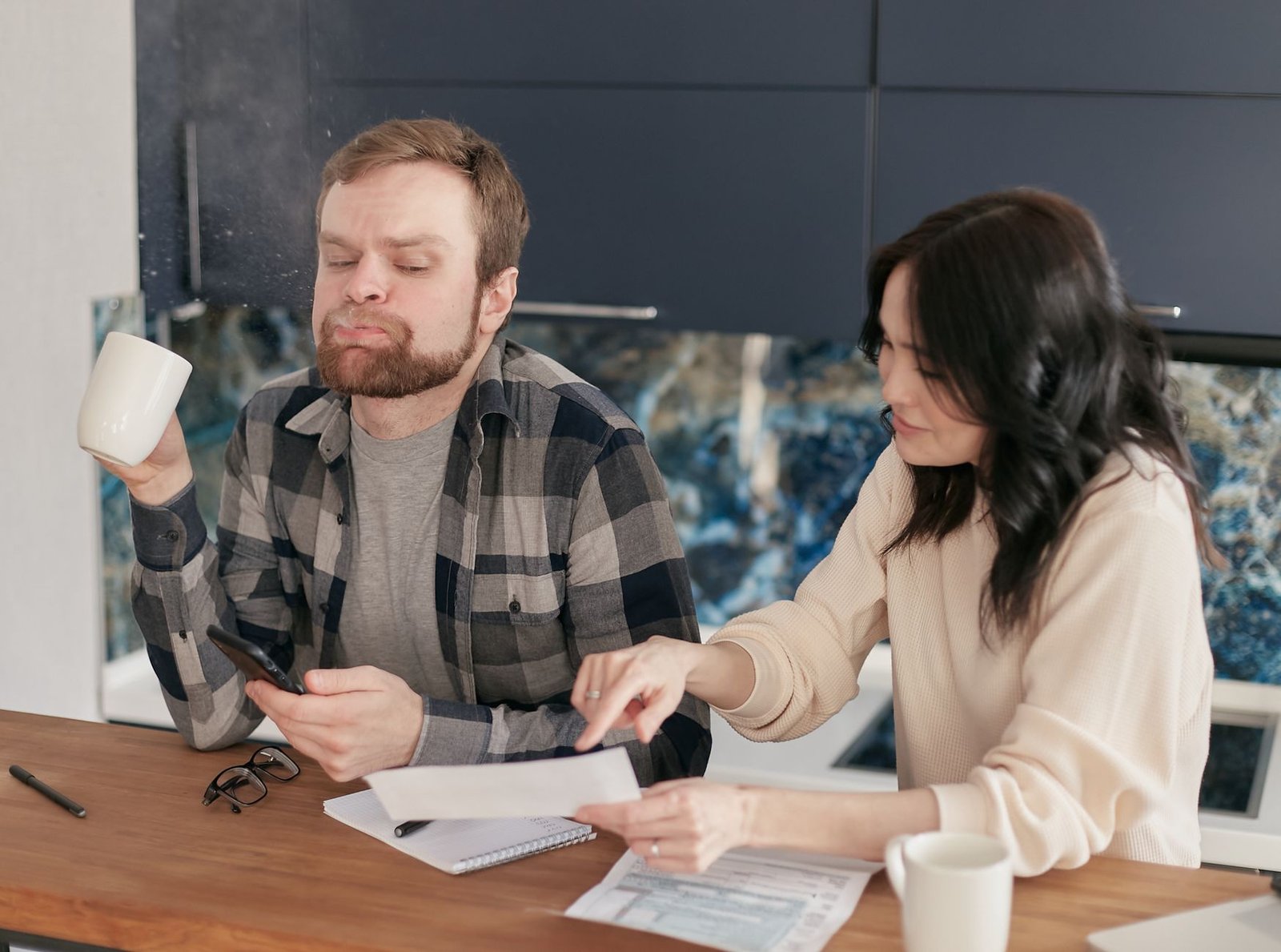 Veteran and spouse checking paperwork about representation costs in VA disability claims