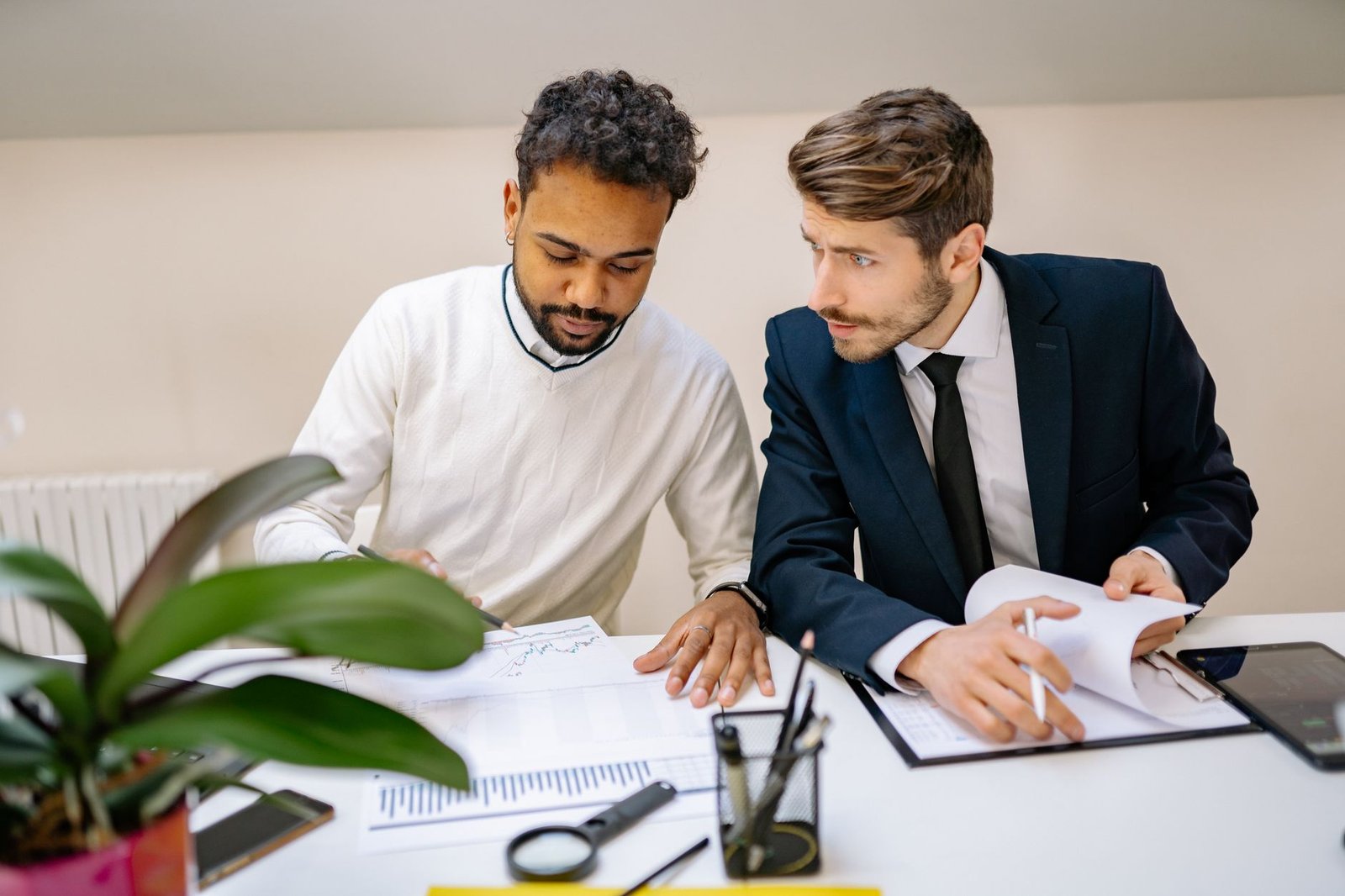 Benefits advisor explaining attorney fees in VA disability claims across a desk