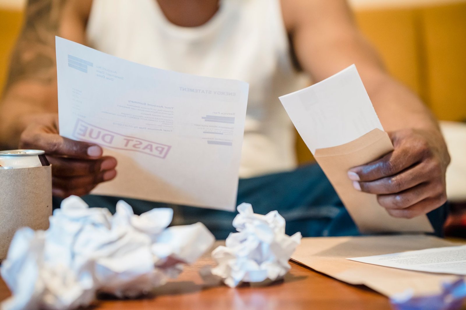 Veteran reviewing household bills while considering VA disability and bankruptcy protections
