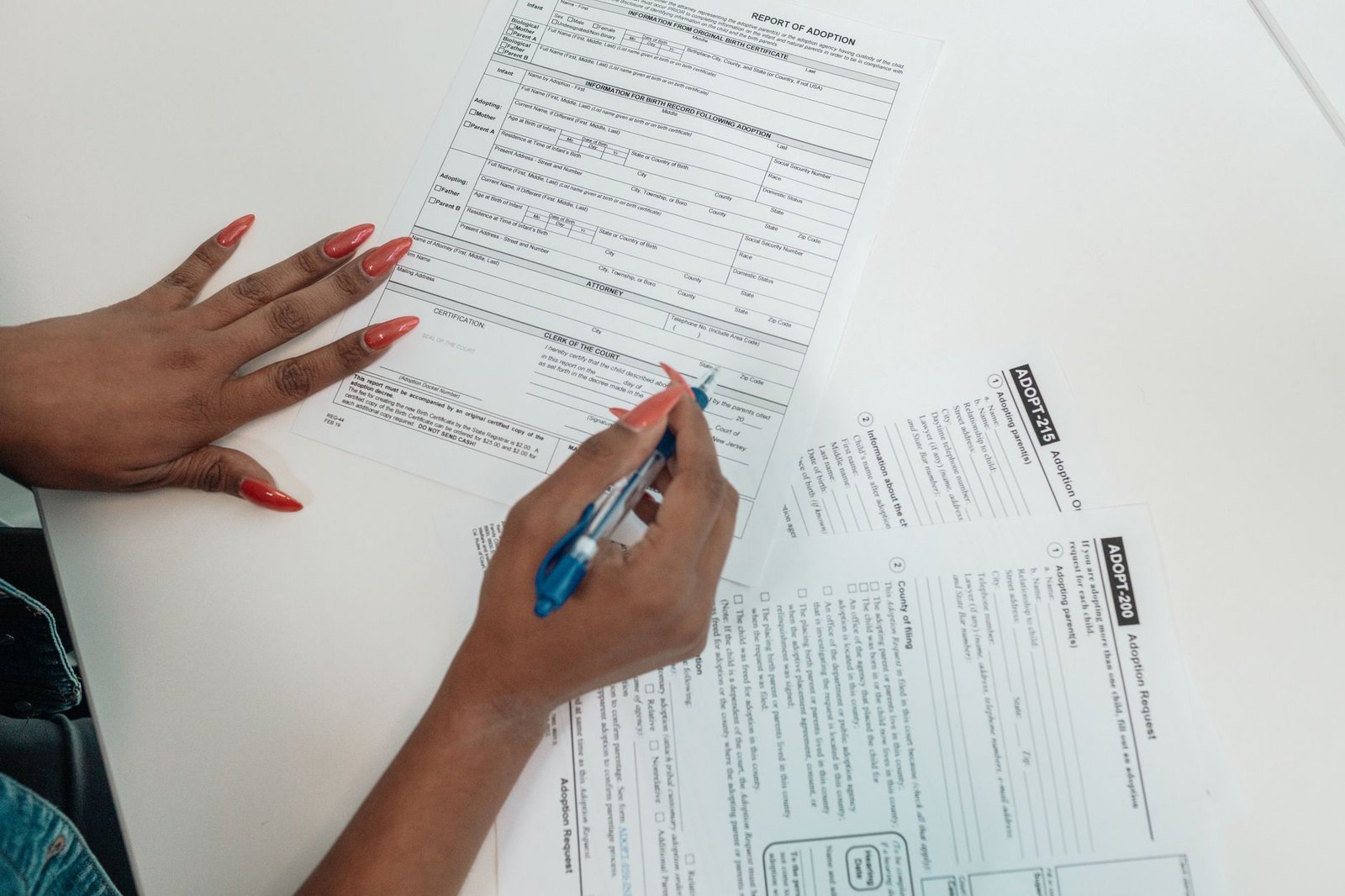 Hands completing benefit forms with help from free legal clinics for veterans