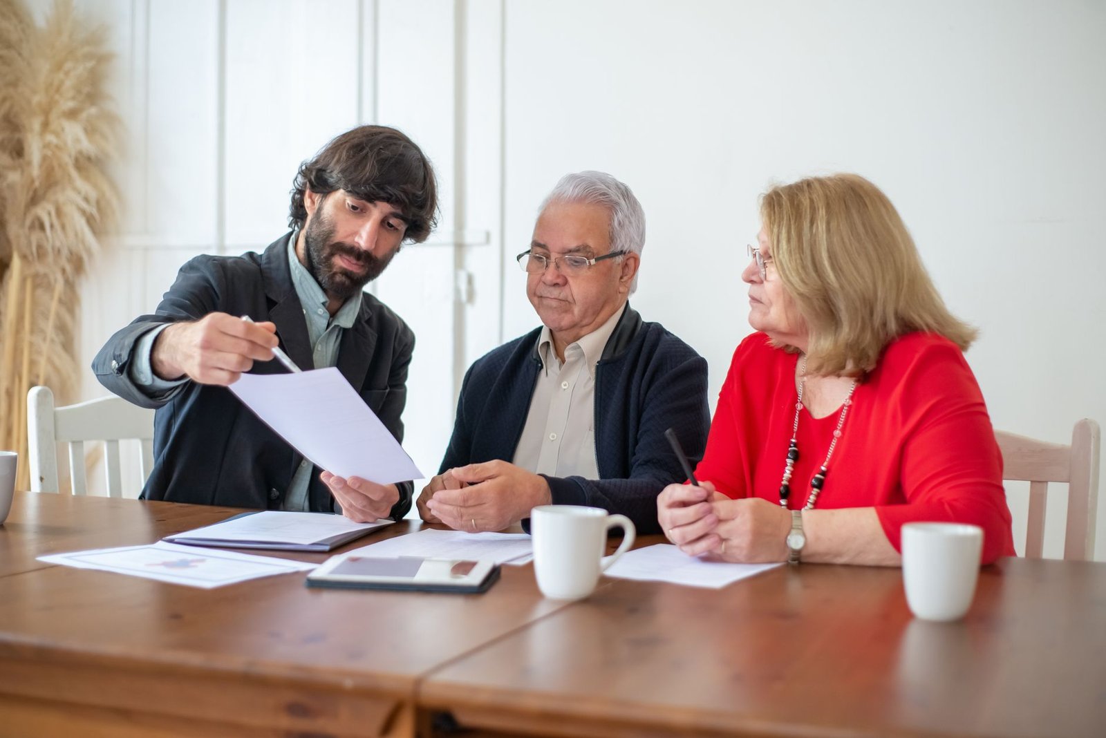 Veteran and spouse reviewing a VA accredited representative power of attorney form with an advisor