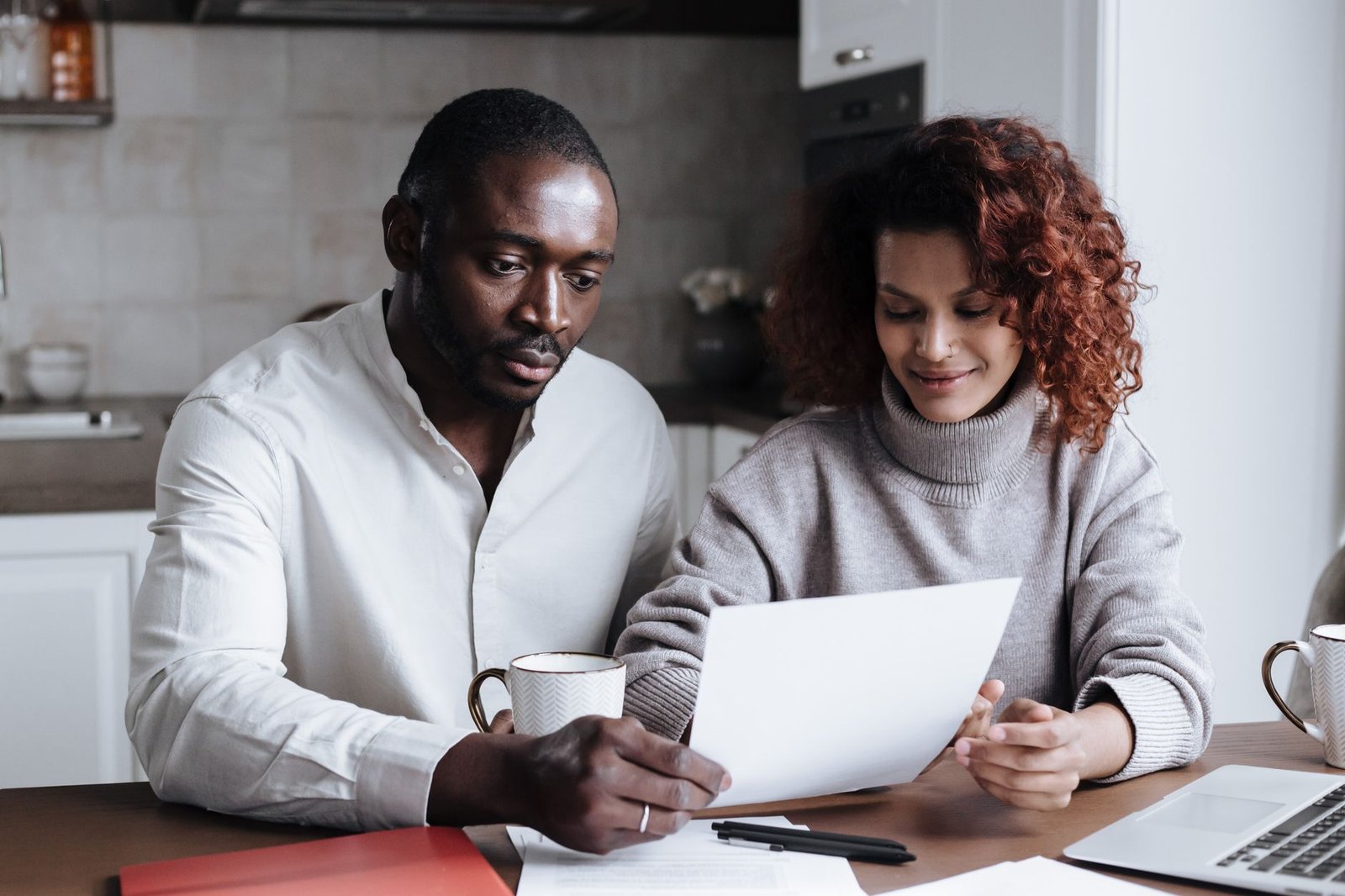 A veteran and spouse reviewing documents before an appointment at a free legal clinic for veterans